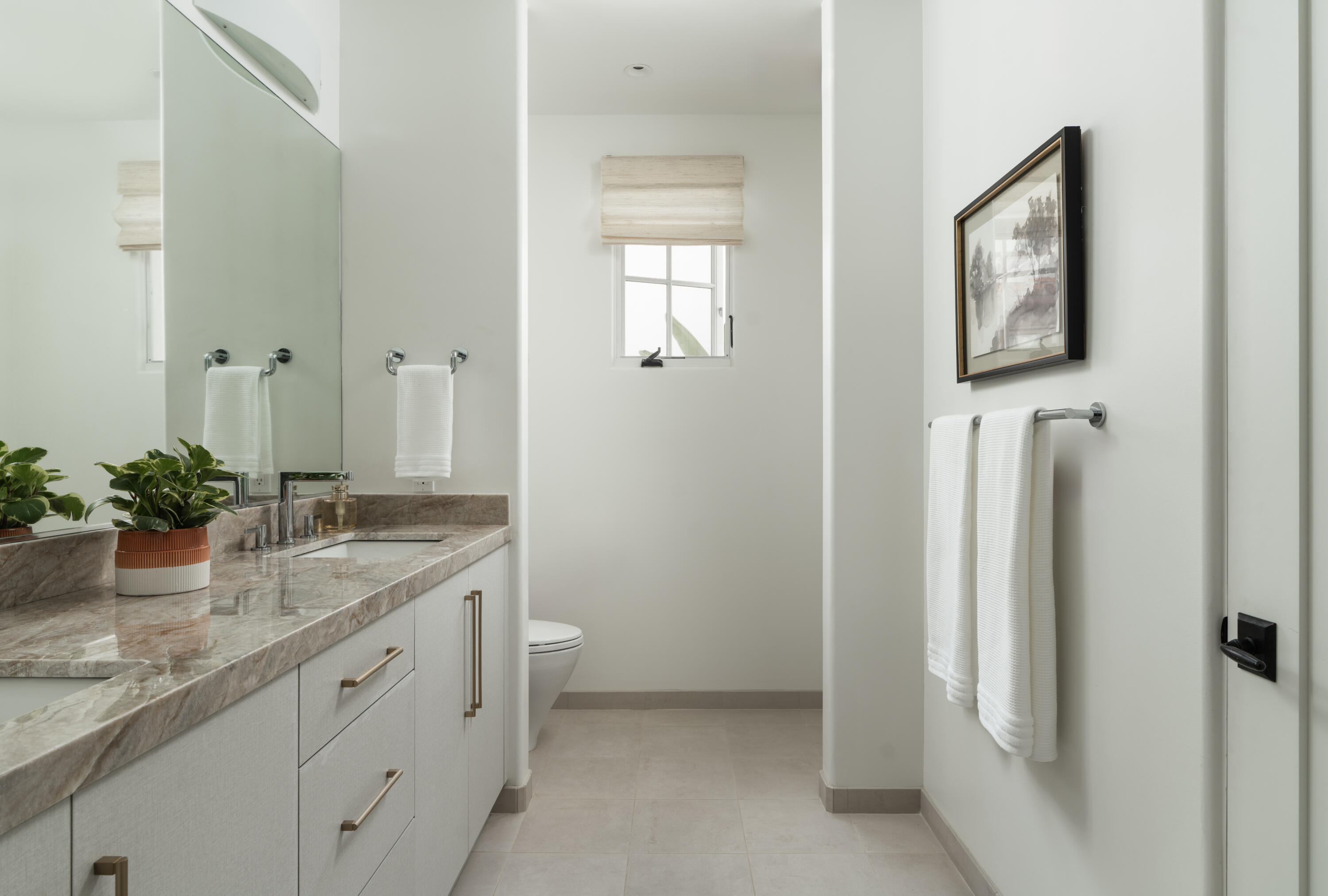 18 West Victoria Street, Unit 206 Santa Barbara, CA 93101 - Photo 9 of 18 a bathroom with a granite countertop sink and a mirror