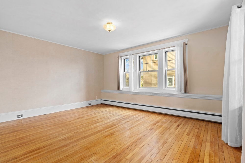 33 Nowell Road Melrose, MA 02176 - Photo 20 of 35 wooden floor in an empty room with a window