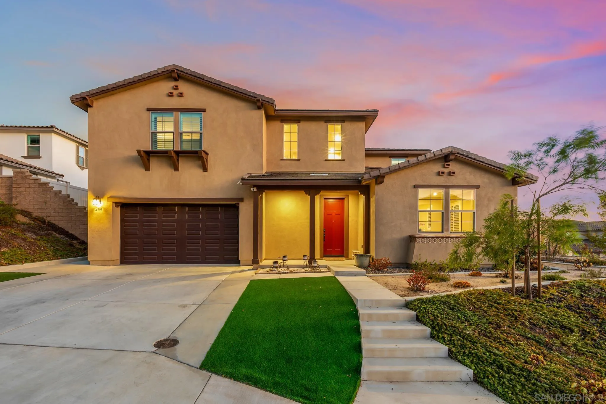2401 Monroe Place Escondido, CA 92027 - Photo 1 of 23 a front view of a house with a yard