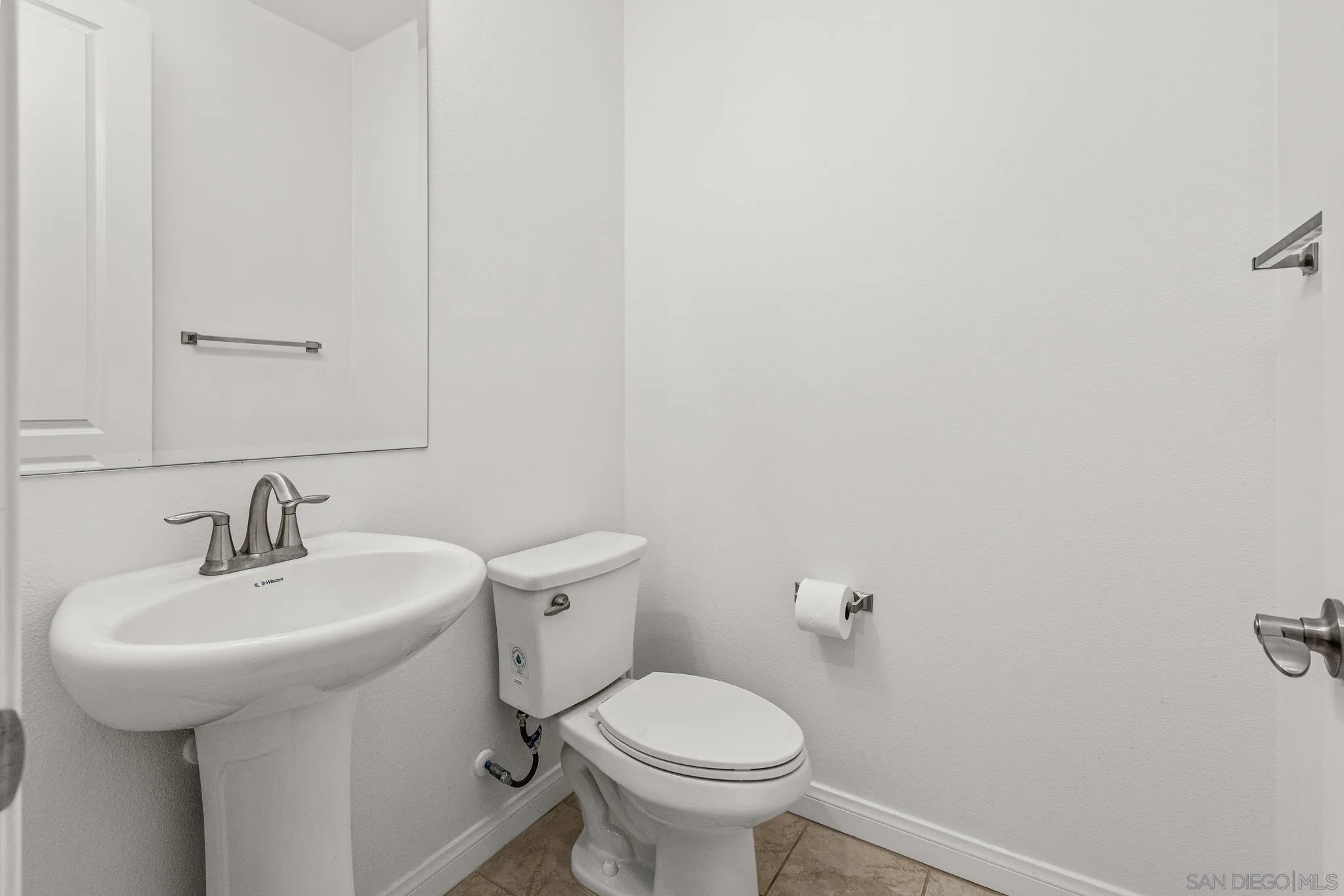 2401 Monroe Place Escondido, CA 92027 - Photo 11 of 23 a bathroom with a sink toilet and a mirror