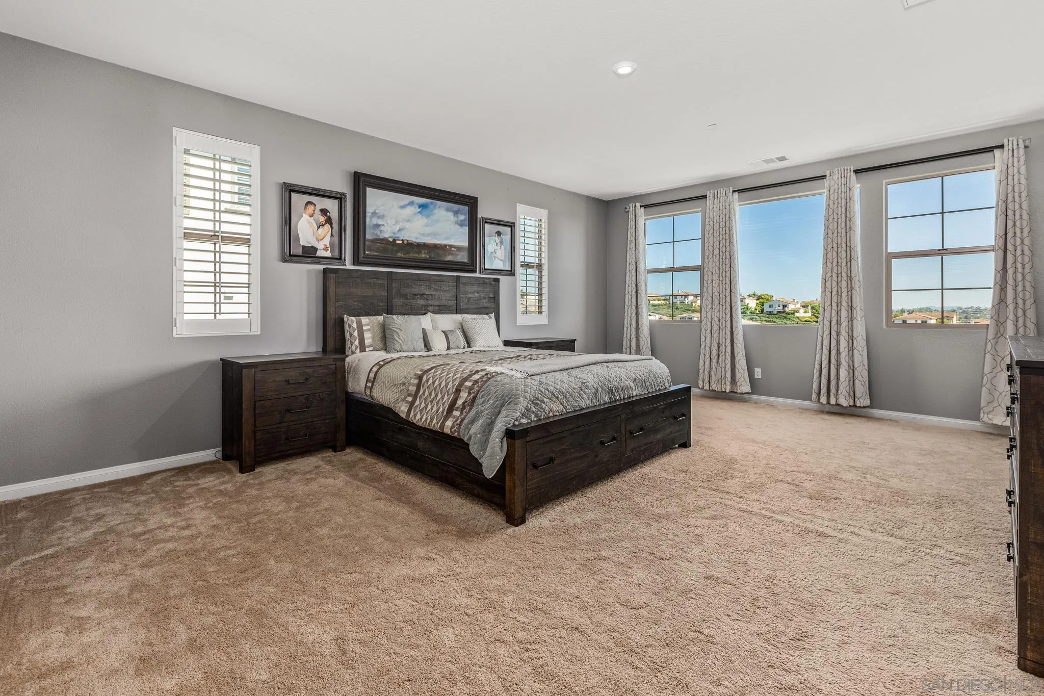 2401 Monroe Place Escondido, CA 92027 - Photo 15 of 23 a spacious bedroom with a large bed and a window