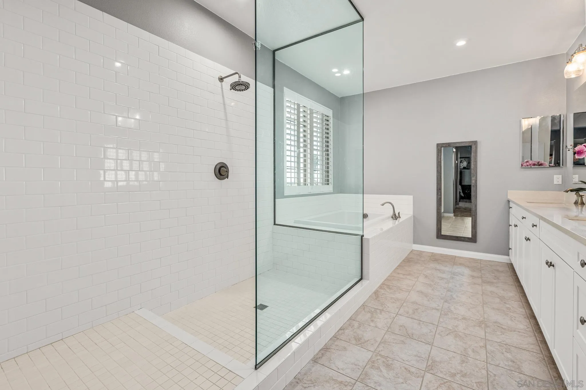 2401 Monroe Place Escondido, CA 92027 - Photo 18 of 23 a bathroom with a tub sink and mirror