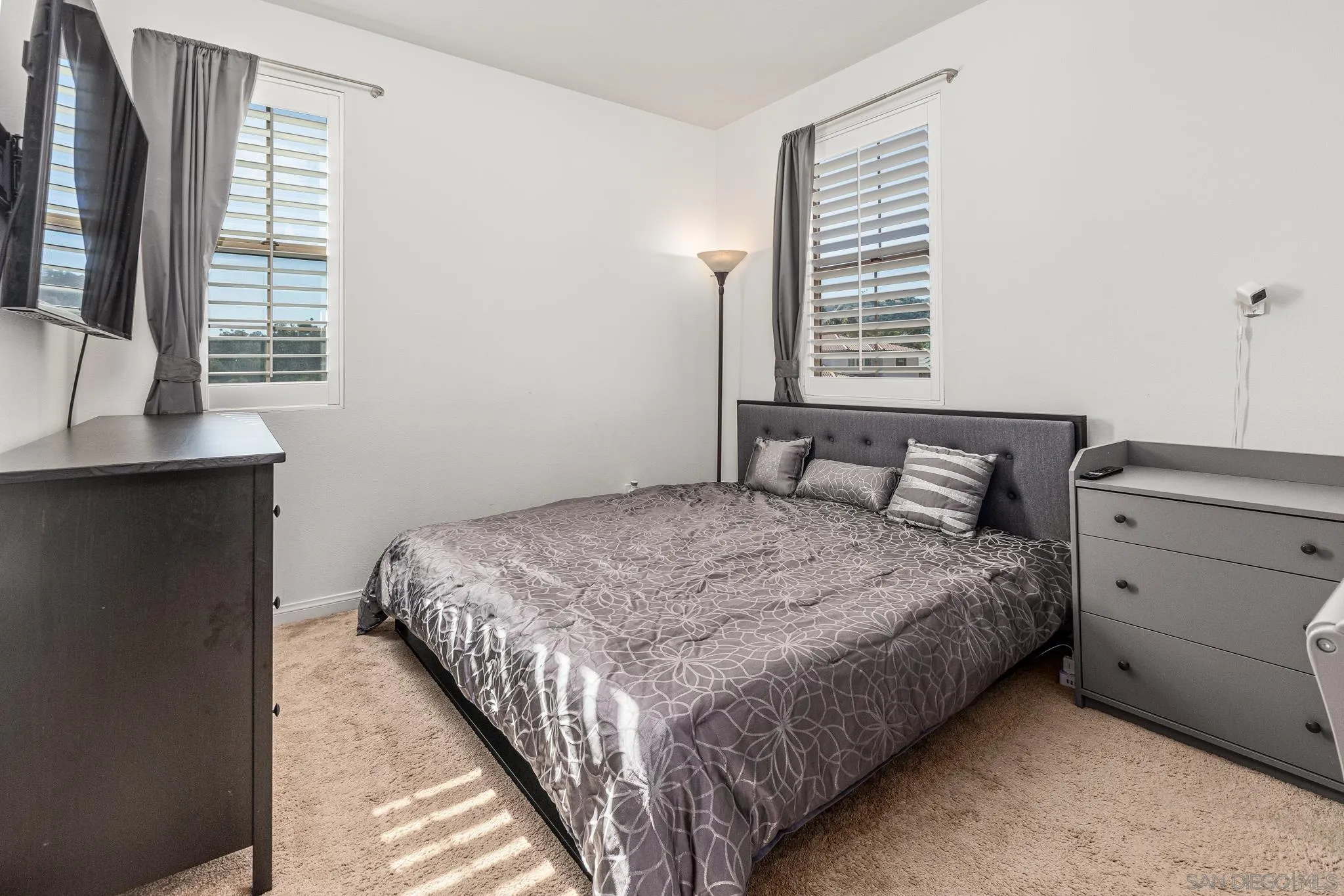 2401 Monroe Place Escondido, CA 92027 - Photo 19 of 23 a bedroom with a bed and a window