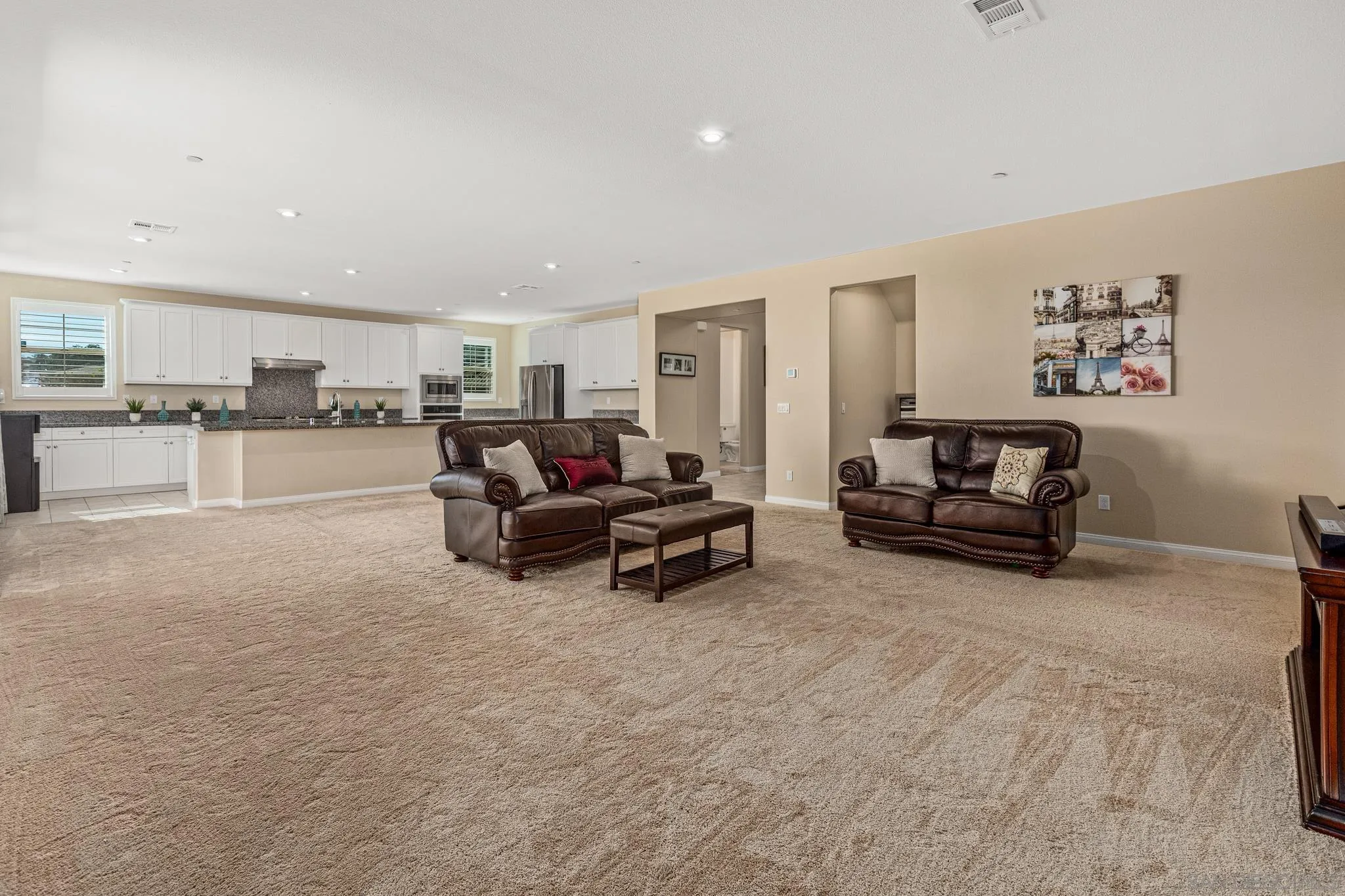 2401 Monroe Place Escondido, CA 92027 - Photo 9 of 23 a living room with furniture and a flat screen tv