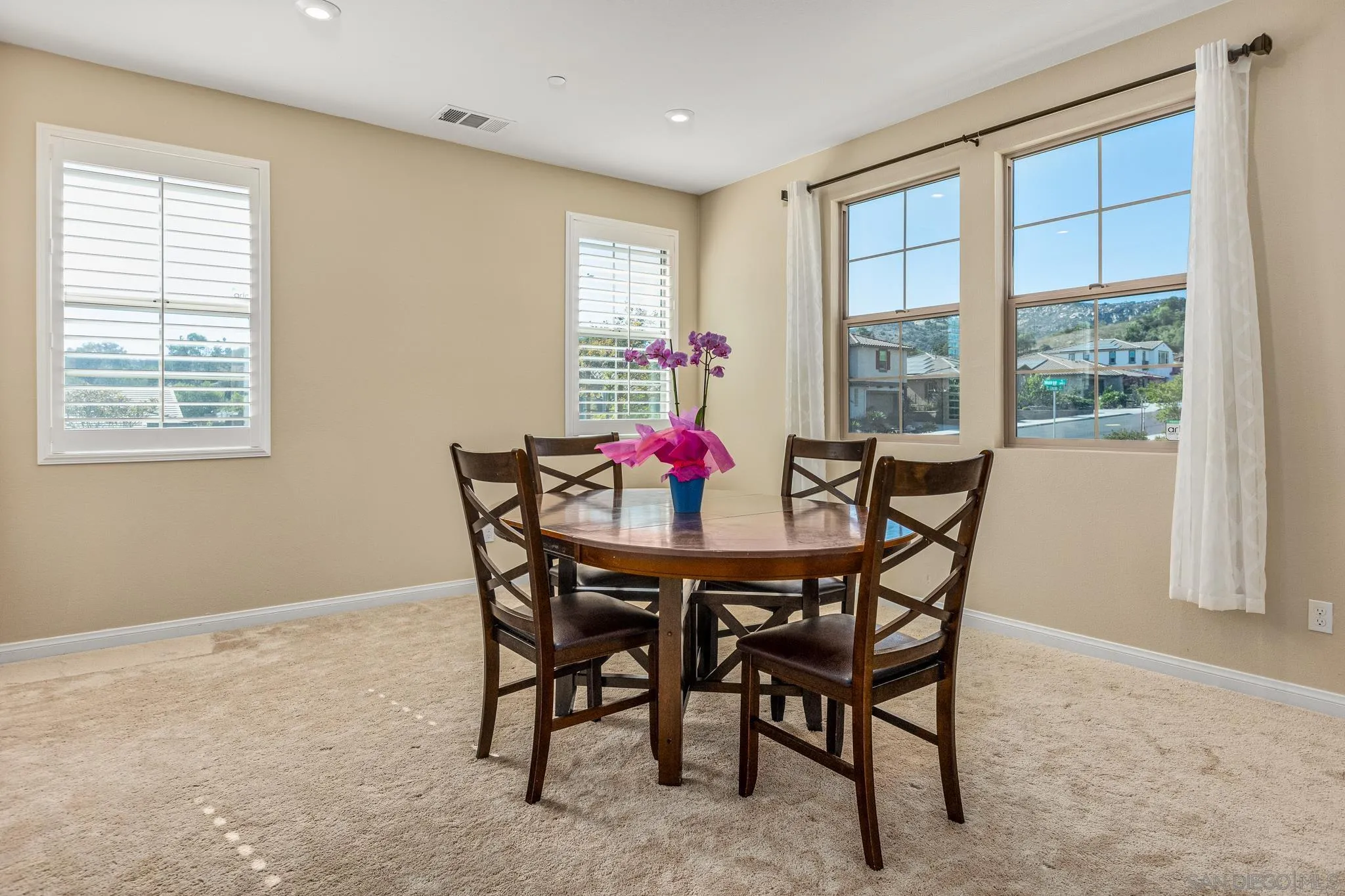 2401 Monroe Place Escondido, CA 92027 - Photo 10 of 23 a dining room with furniture and window