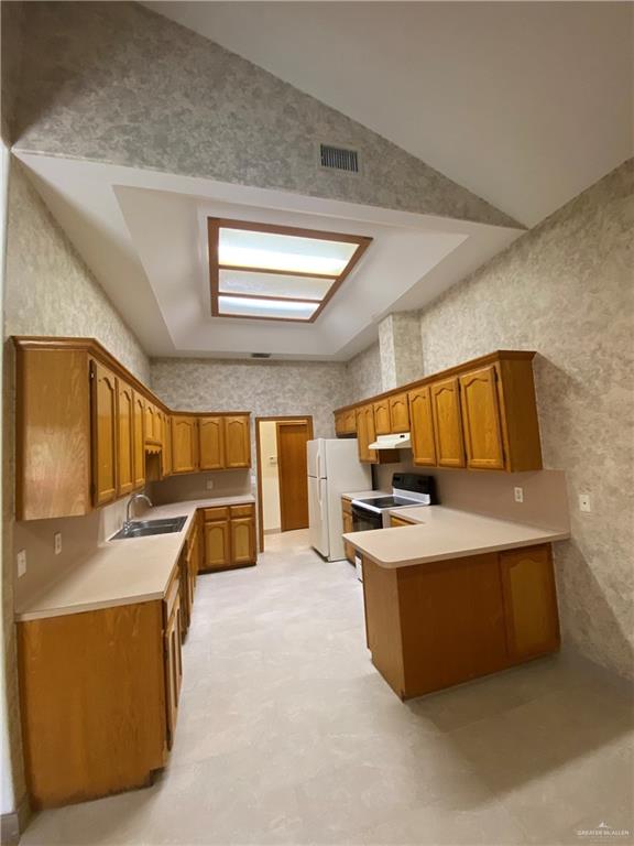 1109 North 47th Street McAllen, TX 78501 - Photo 8 of 21 a kitchen with stainless steel appliances granite countertop a sink and a stove