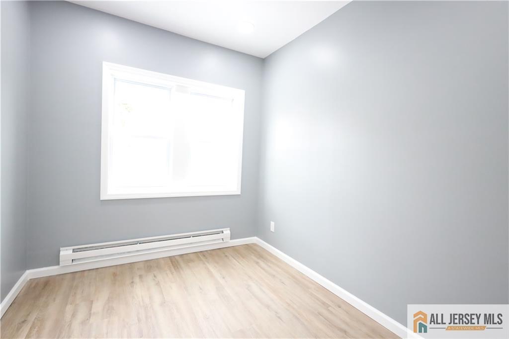 397 Washington Street Perth Amboy, NJ 08861 - Photo 2 of 8 a view of a small space with a window
