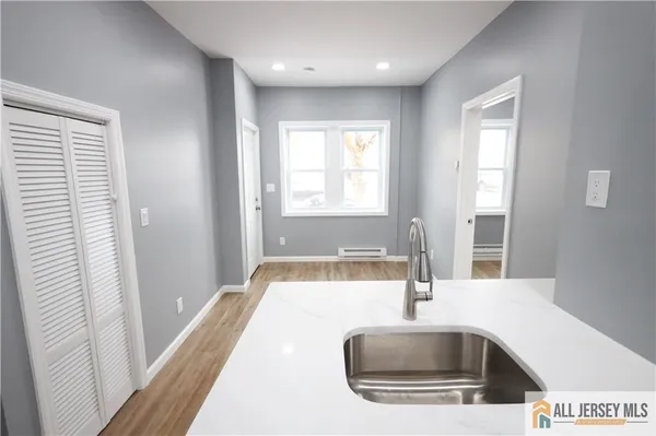 a kitchen with a sink and a window