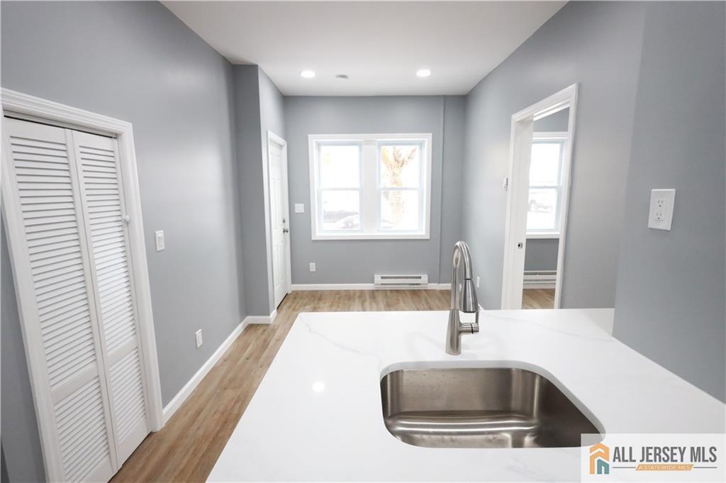 397 Washington Street Perth Amboy, NJ 08861 - Photo 7 of 8 a kitchen with a sink and a window