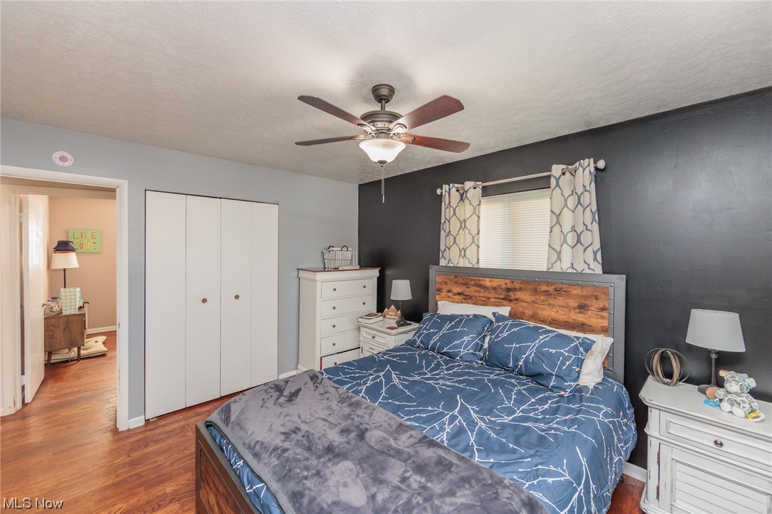 4260 Ridgeview Road Cleveland, OH 44144 - Photo 29 of 34 Bedroom featuring a closet, hardwood / wood-style floors, and ceiling fan