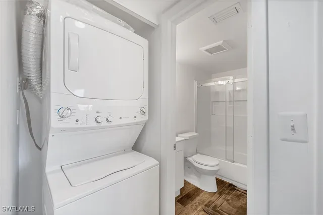 a view of bathroom with a toilet and a shower