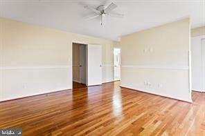 2 Hamlet Hill Road Baltimore, MD 21210 - Photo 17 of 25 an empty room with wooden floor and windows