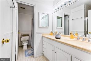 2 Hamlet Hill Road Baltimore, MD 21210 - Photo 18 of 25 a en suite bathroom with a granite countertop sink and a mirror