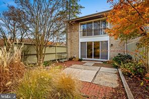 2 Hamlet Hill Road Baltimore, MD 21210 - Photo 23 of 25 a front view of a house with a yard and potted plants