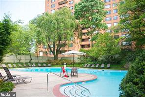 2 Hamlet Hill Road Baltimore, MD 21210 - Photo 24 of 25 a view of a patio with a table and chairs under an umbrella