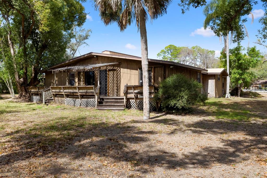 3034 Proctor Road Sarasota, FL 34231 - Photo 11 of 22 a front view of a house with a yard