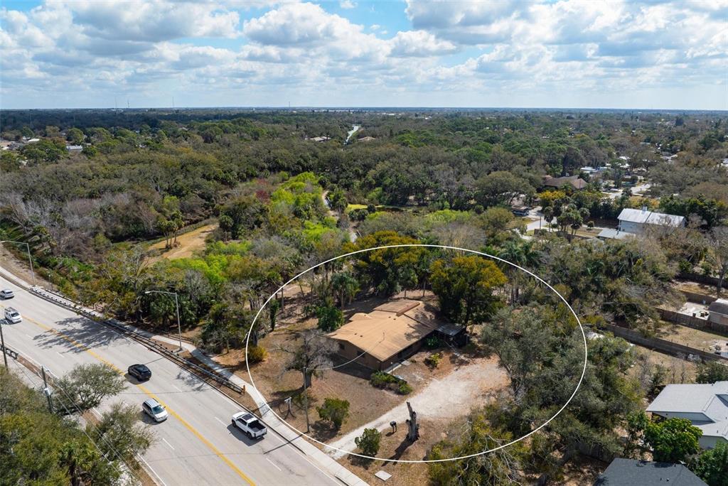 3034 Proctor Road Sarasota, FL 34231 - Photo 12 of 22 an aerial view of a house with a yard
