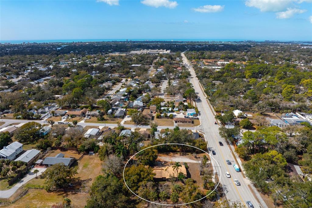 3034 Proctor Road Sarasota, FL 34231 - Photo 15 of 22 an aerial view of a residential houses with outdoor space and trees