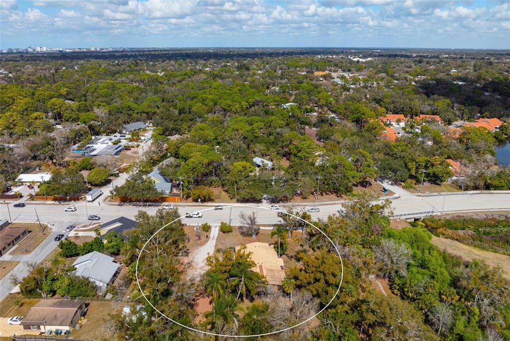 3034 Proctor Road Sarasota, FL 34231 - Photo 19 of 22 an aerial view of residential houses with outdoor space