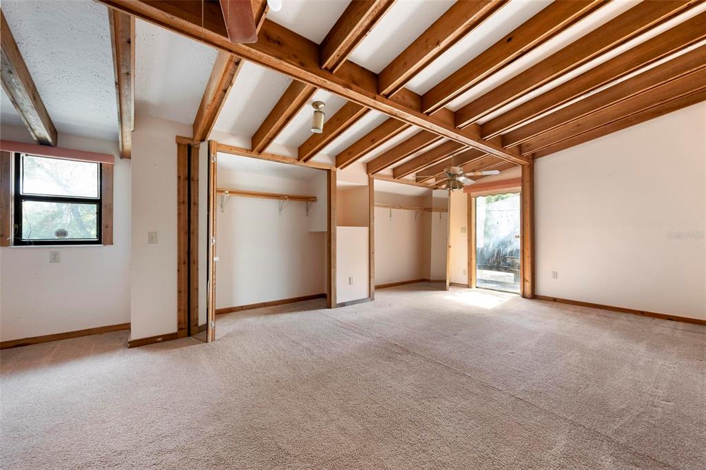 3034 Proctor Road Sarasota, FL 34231 - Photo 6 of 22 an empty room with windows