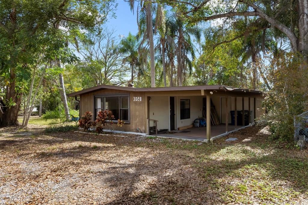 3034 Proctor Road Sarasota, FL 34231 - Photo 7 of 22 a view of a house with backyard