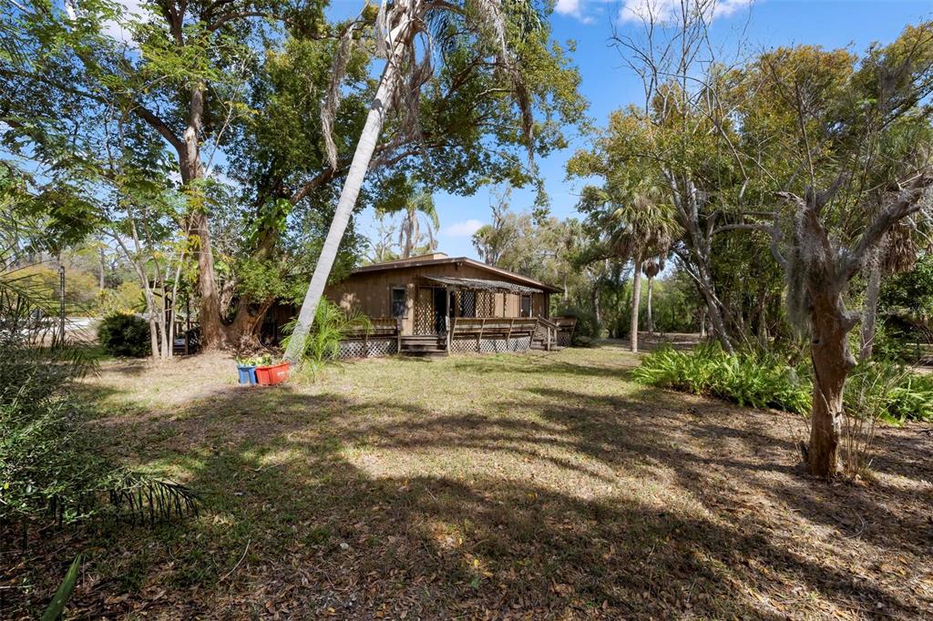3034 Proctor Road Sarasota, FL 34231 - Photo 8 of 22 a view of a house with yard and sitting area
