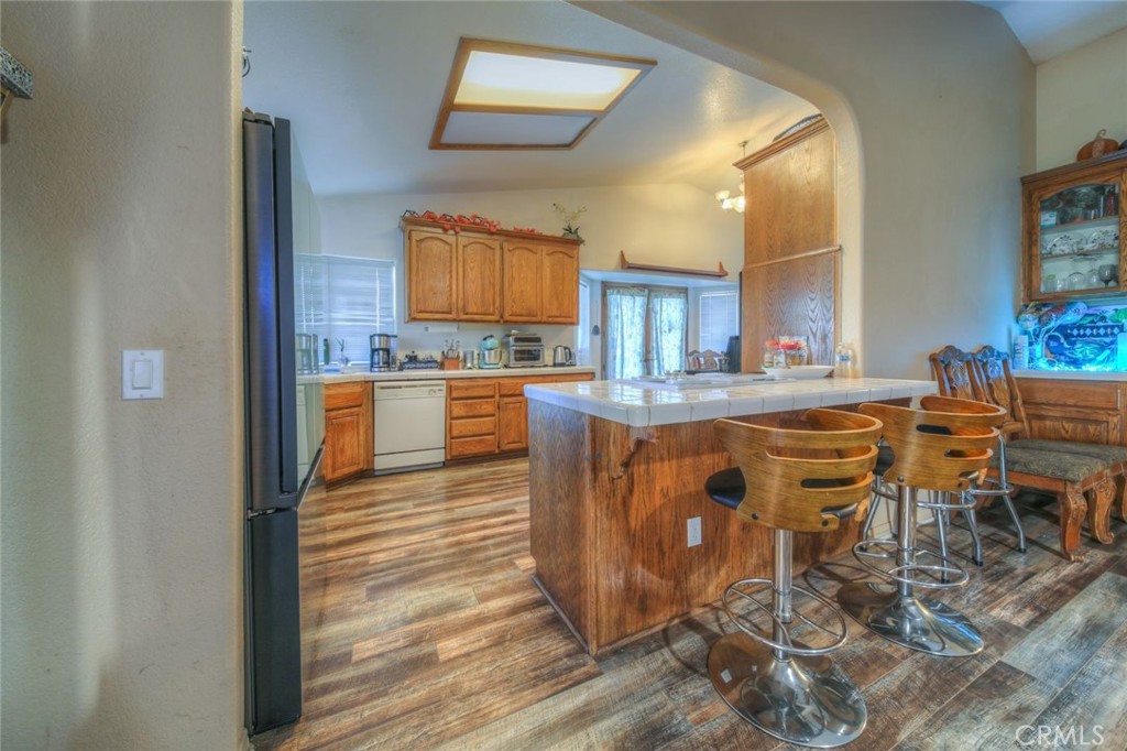 57775 Bailey Road Anza, CA 92539 - Photo 13 of 55 a kitchen with stainless steel appliances granite countertop a table chairs sink and cabinets