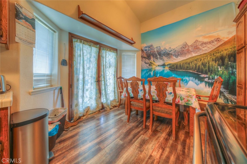 57775 Bailey Road Anza, CA 92539 - Photo 19 of 55 a dining room with furniture and wooden floor