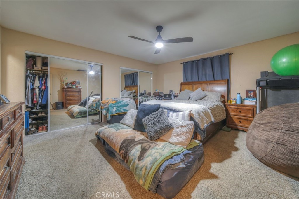 57775 Bailey Road Anza, CA 92539 - Photo 28 of 55 a bedroom with a large bed and a couch