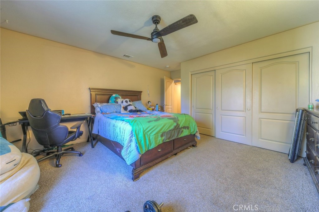 57775 Bailey Road Anza, CA 92539 - Photo 31 of 55 a bedroom with a bed a desk and chair