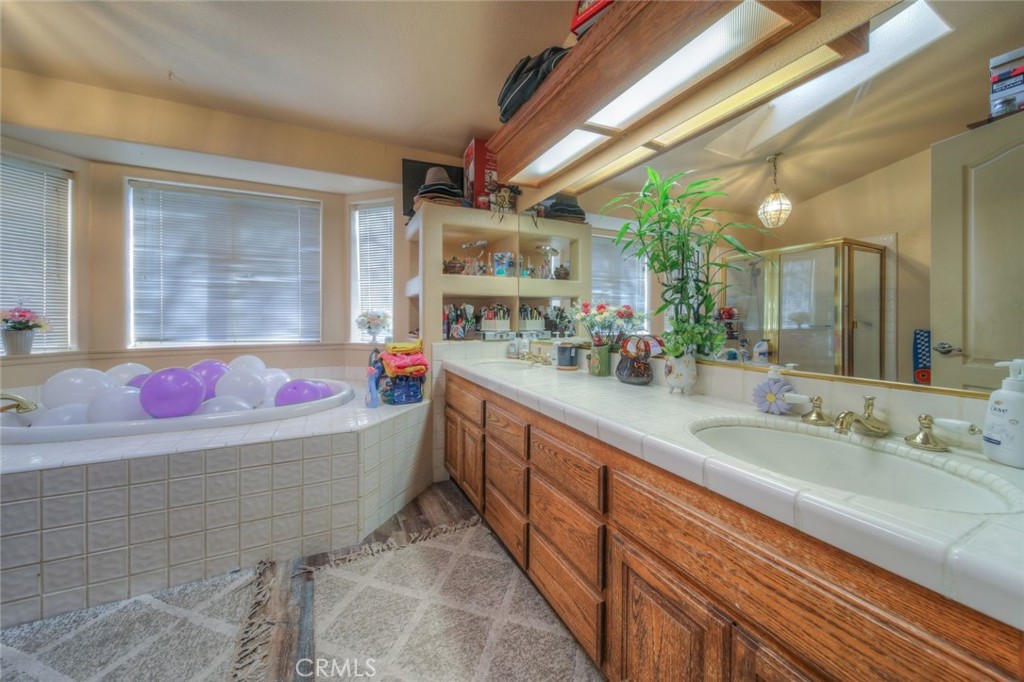 57775 Bailey Road Anza, CA 92539 - Photo 34 of 55 a bathroom with a granite countertop sink and a mirror