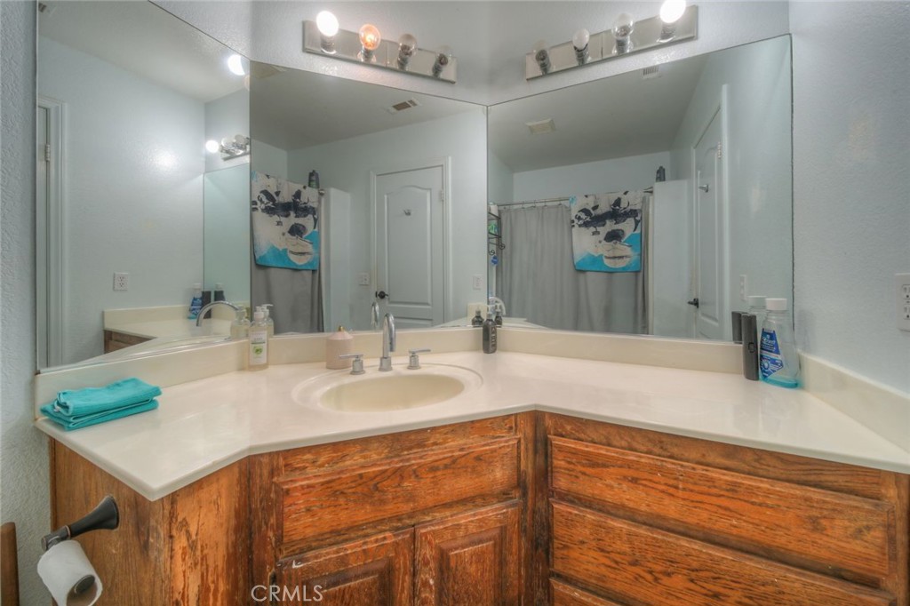 57775 Bailey Road Anza, CA 92539 - Photo 36 of 55 a bathroom with a sink and a mirror