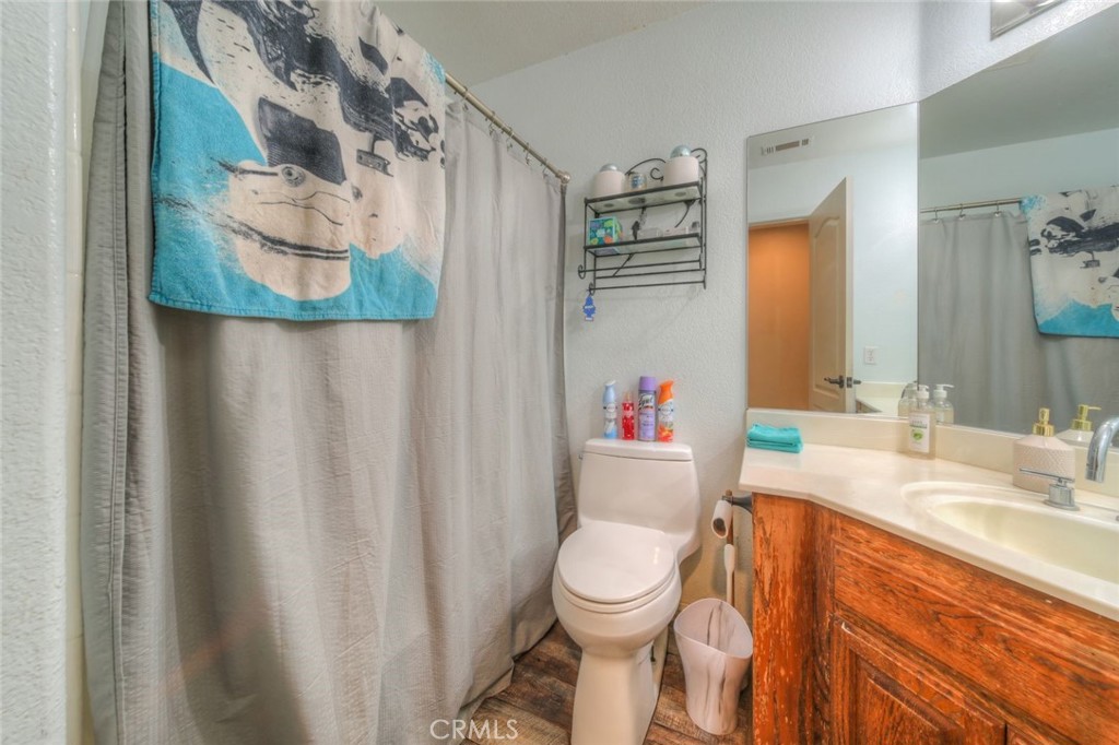 57775 Bailey Road Anza, CA 92539 - Photo 40 of 55 a bathroom with a granite countertop sink and a mirror