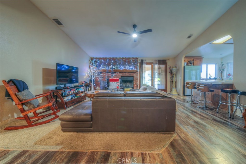 57775 Bailey Road Anza, CA 92539 - Photo 8 of 55 a living room with furniture a fireplace and a flat screen tv