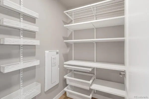 a kitchen with stainless steel appliances granite countertop a stove and a refrigerator