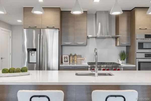 a sink with a vase and flowers