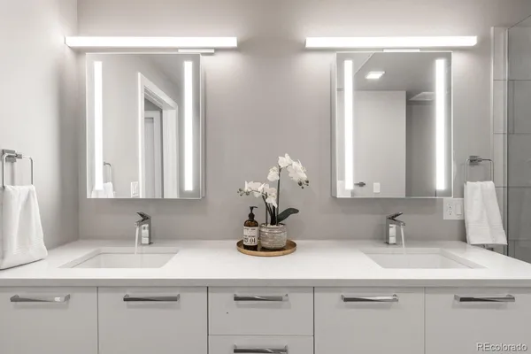 a bedroom with a large bed and a large window