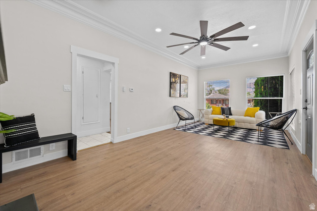 327 35th Street Ogden, UT 84401 - Photo 10 of 31 Open-concept living area featuring wood-finish flooring, a contemporary ceiling fan, recessed lighting, and crown molding