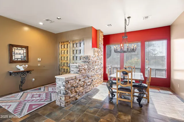 a view of a dining room with furniture window and outside view
