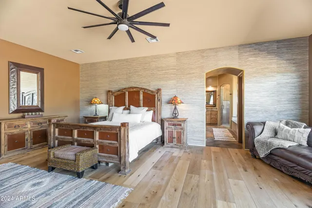 a bed room with furniture and wooden floor