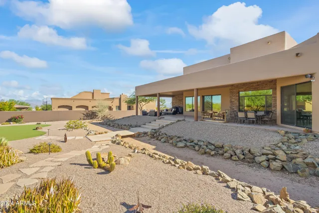 a view of a house with basketball court