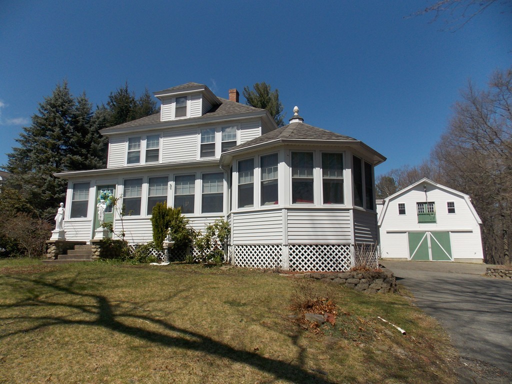 79 Haverhill Road Amesbury, MA 01913 - Photo 1 of 25 a front view of a house with a yard