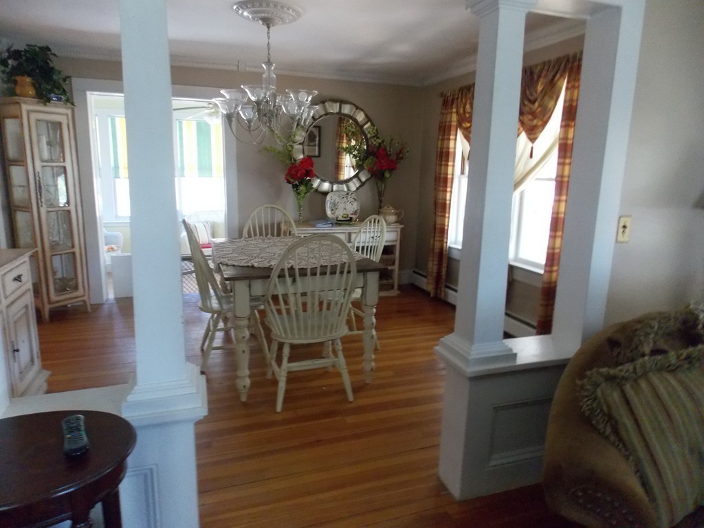 79 Haverhill Road Amesbury, MA 01913 - Photo 11 of 25 a view of a dining room with furniture window and wooden floor