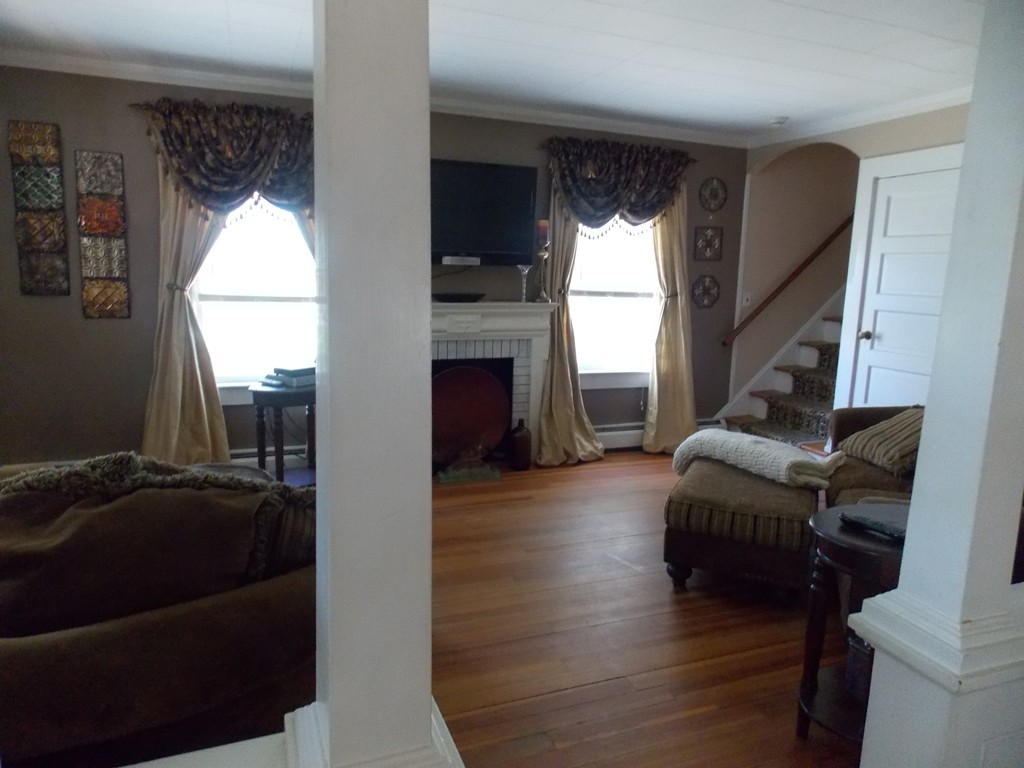 79 Haverhill Road Amesbury, MA 01913 - Photo 12 of 25 a living room with furniture and a fireplace