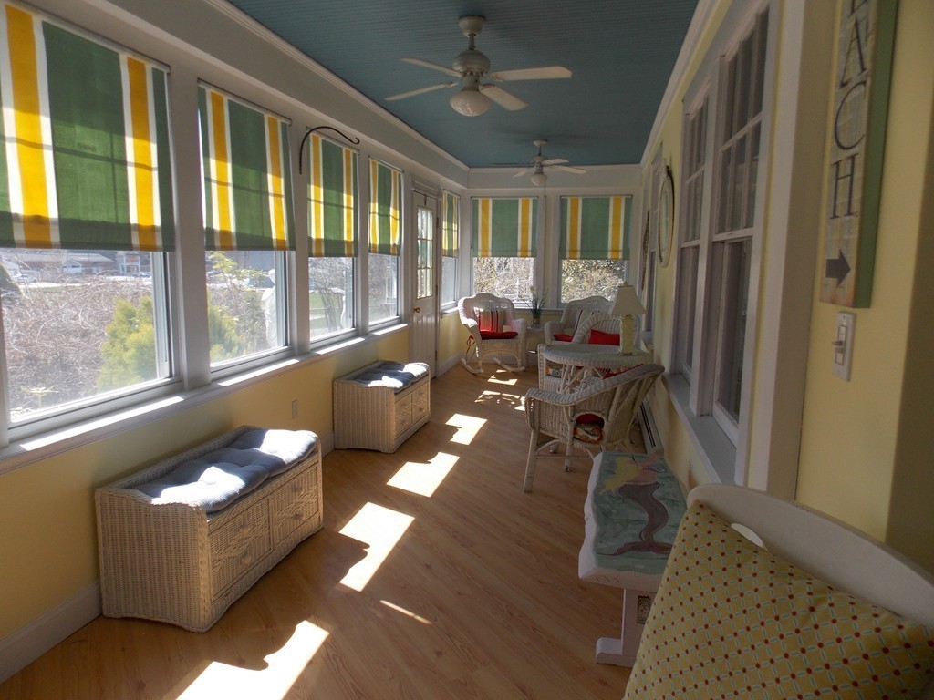 79 Haverhill Road Amesbury, MA 01913 - Photo 14 of 25 a living room with furniture and a floor to ceiling window