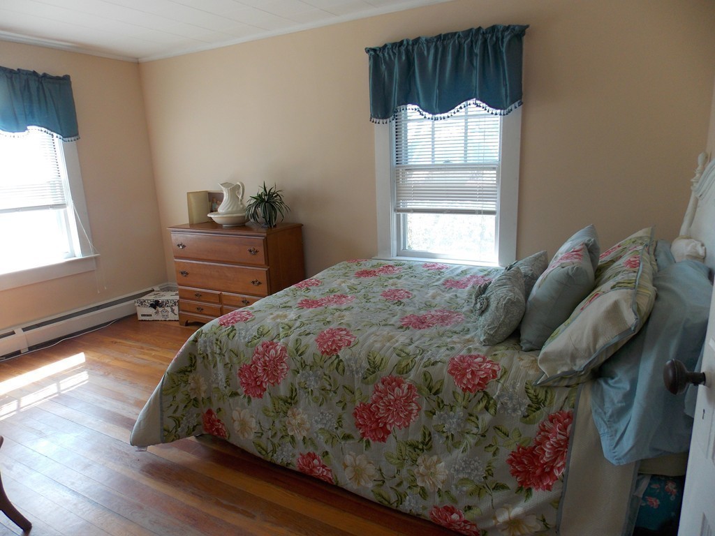 79 Haverhill Road Amesbury, MA 01913 - Photo 19 of 25 a bedroom with a bed and a window