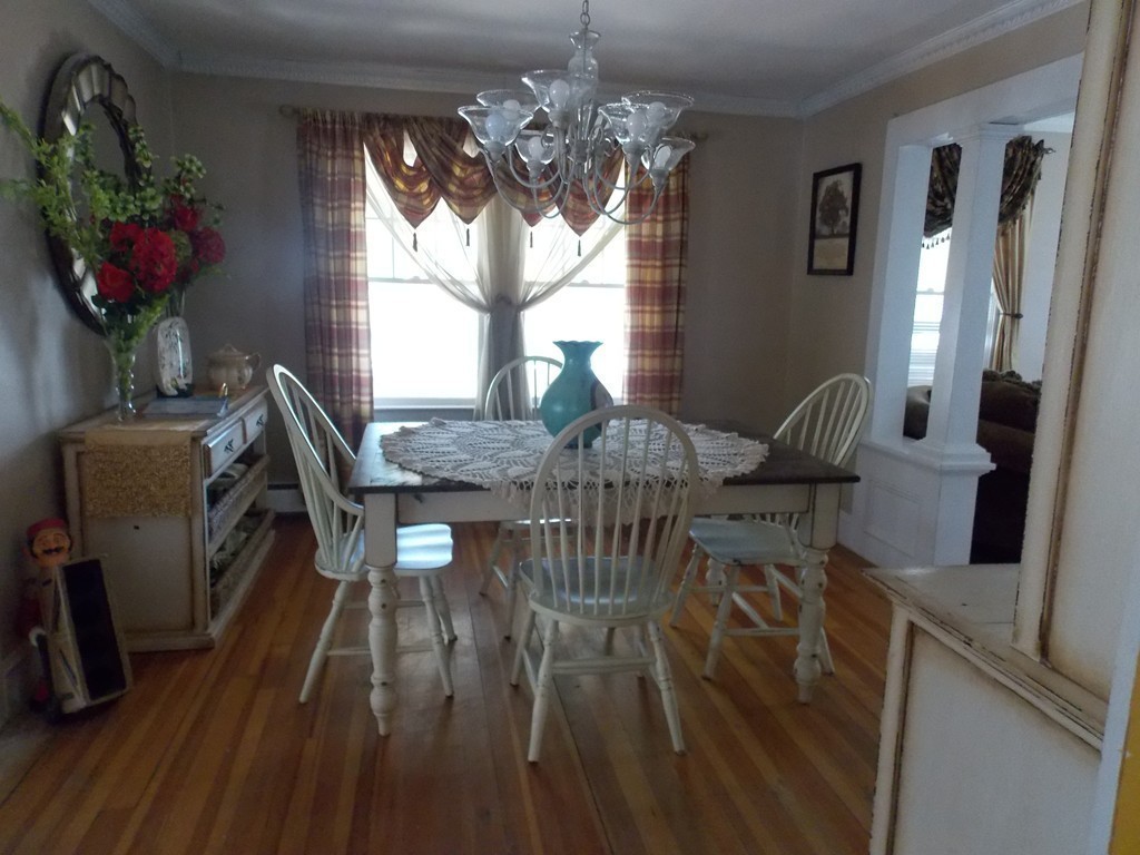 79 Haverhill Road Amesbury, MA 01913 - Photo 20 of 25 a view of a dining room with furniture window and wooden floor