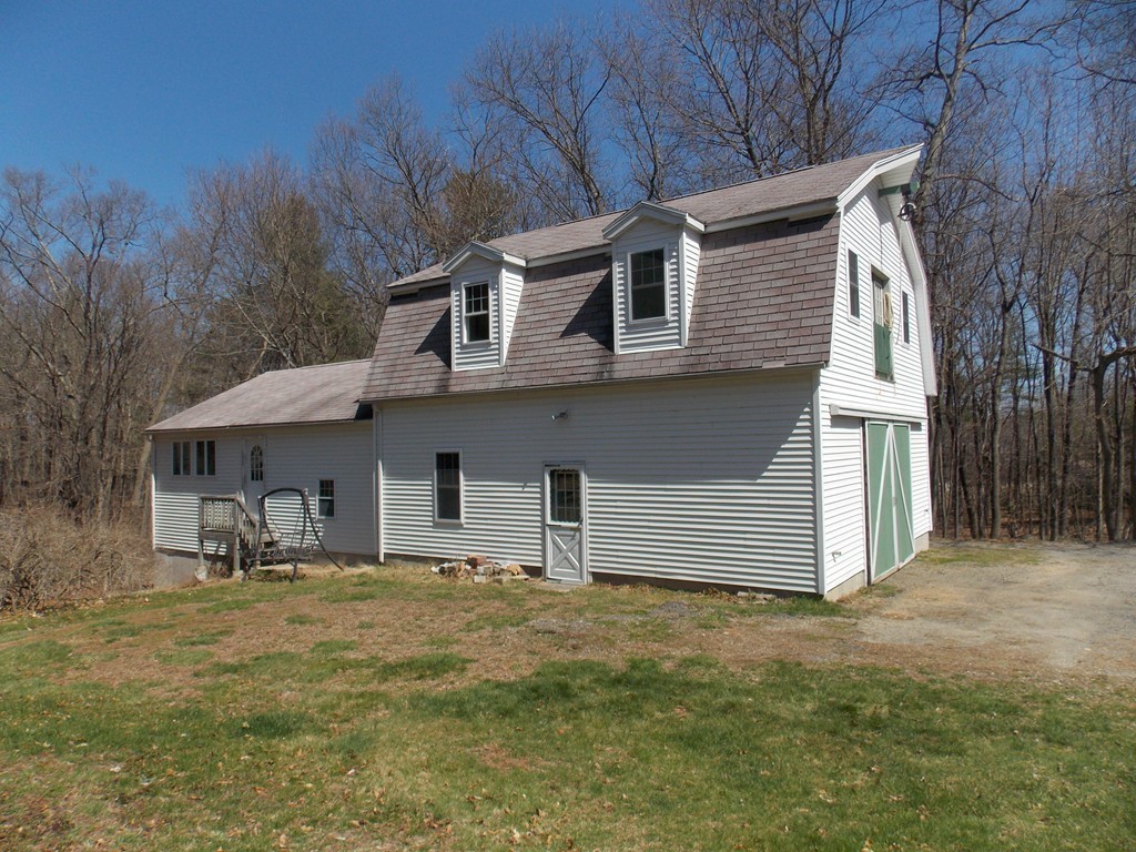 79 Haverhill Road Amesbury, MA 01913 - Photo 22 of 25 a front view of a house with garden