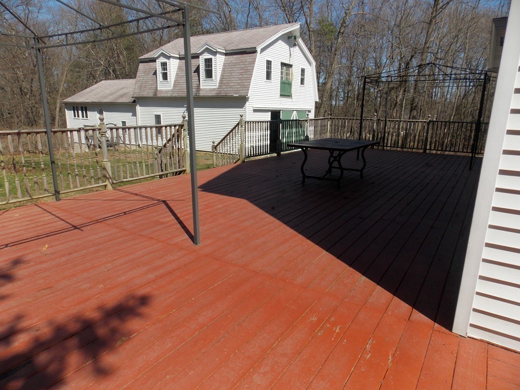 79 Haverhill Road Amesbury, MA 01913 - Photo 25 of 25 a view of a house with backyard and sitting area