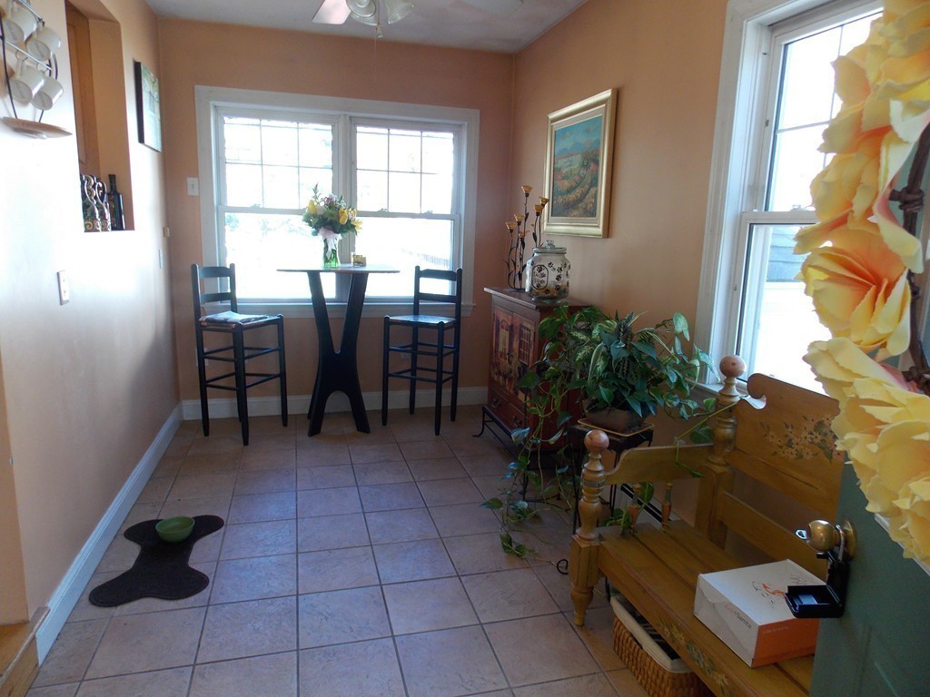 79 Haverhill Road Amesbury, MA 01913 - Photo 8 of 25 a view of a livingroom with furniture and a window